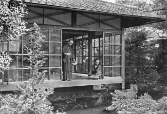 NAMIKAWA SAN FEEDING HIS CARP In lotus-land Japan, 1910 by H.G.Ponting